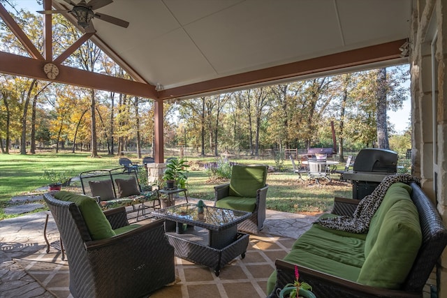 view of patio / terrace featuring an outdoor living space, area for grilling, and ceiling fan