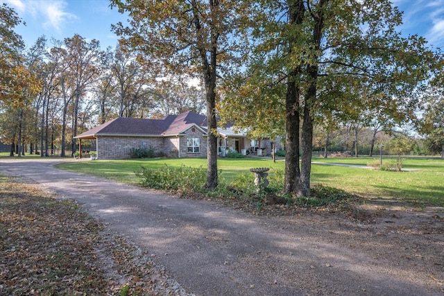 view of side of property featuring a yard