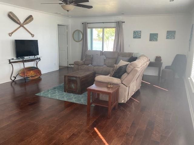 living room featuring crown molding, ceiling fan, and dark hardwood / wood-style flooring