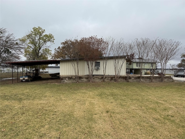 view of property exterior featuring a yard and a carport