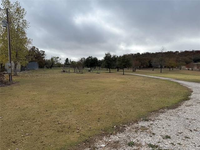 view of yard with a rural view