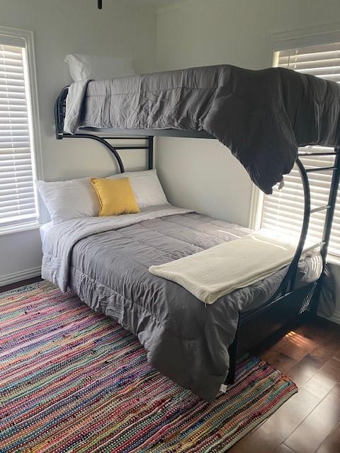 bedroom with hardwood / wood-style floors