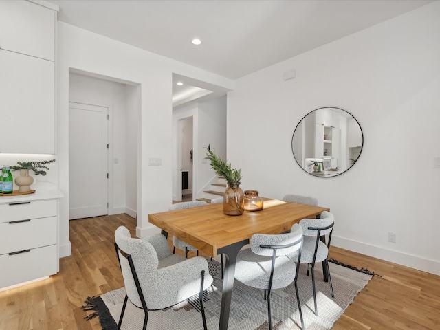 dining space with light wood-type flooring