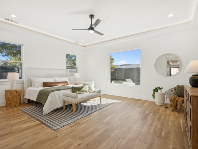 bedroom featuring light hardwood / wood-style flooring and ceiling fan