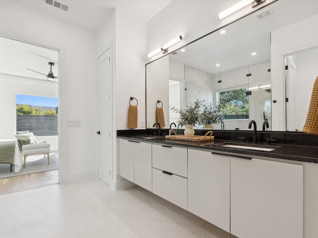 bathroom featuring ceiling fan and vanity