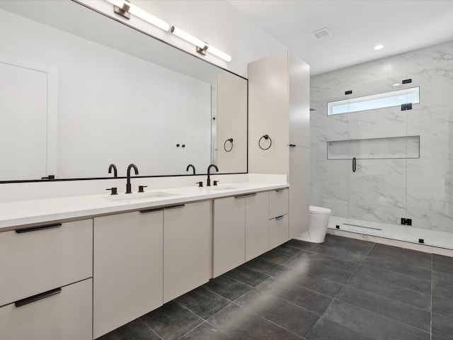 bathroom with tile patterned floors, vanity, toilet, and walk in shower