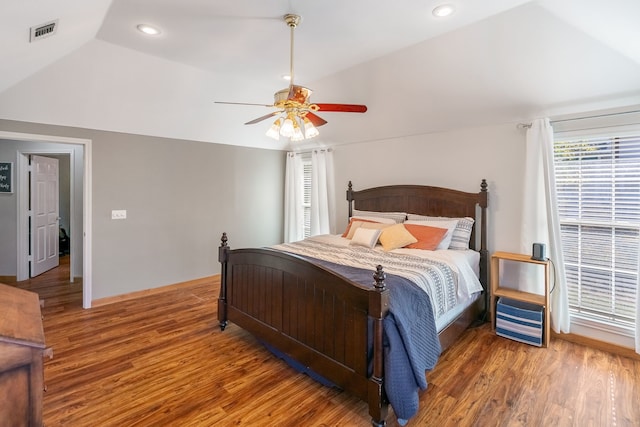 bedroom featuring vaulted ceiling, ceiling fan, and dark wood-type flooring