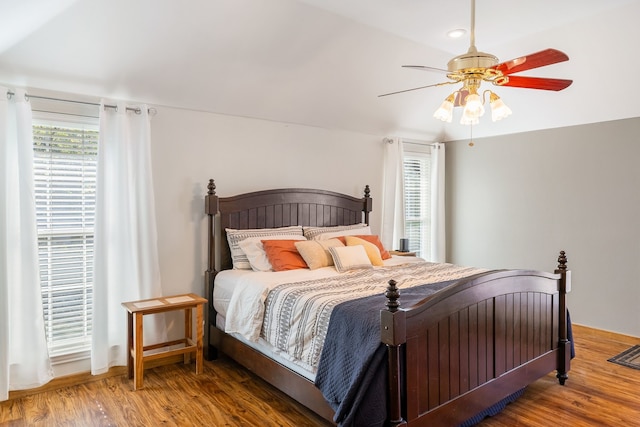 bedroom with hardwood / wood-style floors and ceiling fan