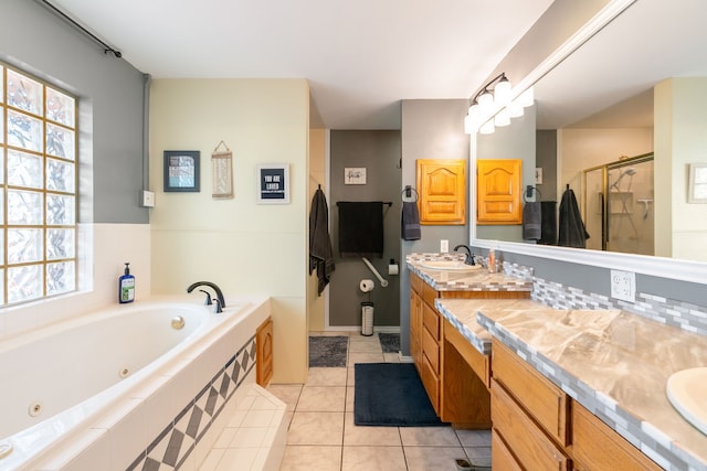 bathroom featuring vanity, tile patterned floors, a healthy amount of sunlight, and separate shower and tub