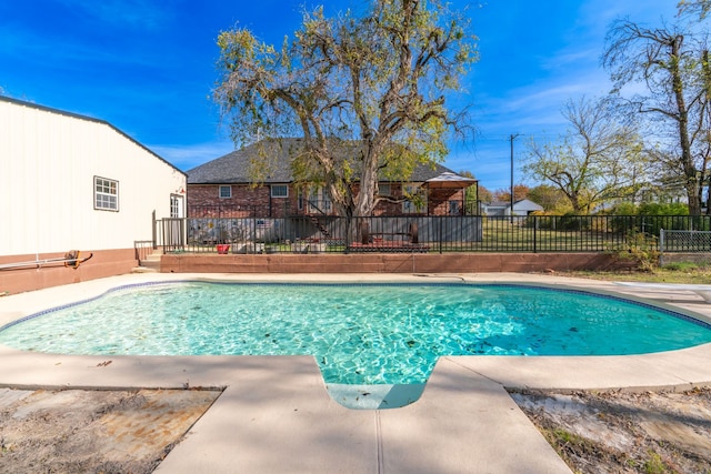 view of pool with fence and a fenced in pool