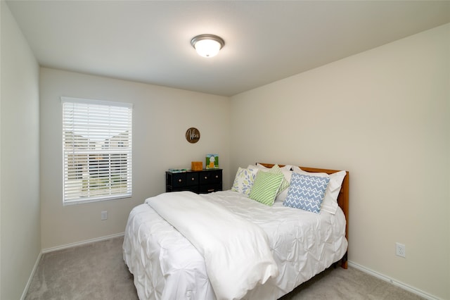 bedroom with light carpet