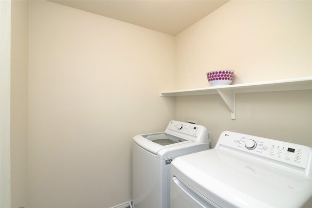 washroom with separate washer and dryer