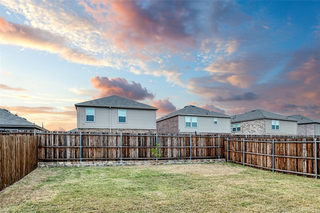 view of yard at dusk