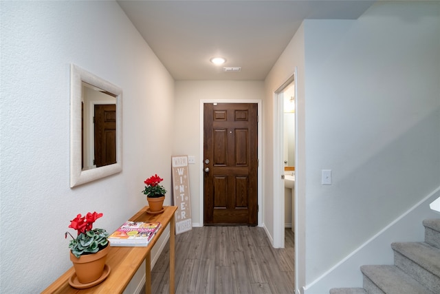 entryway with light hardwood / wood-style flooring