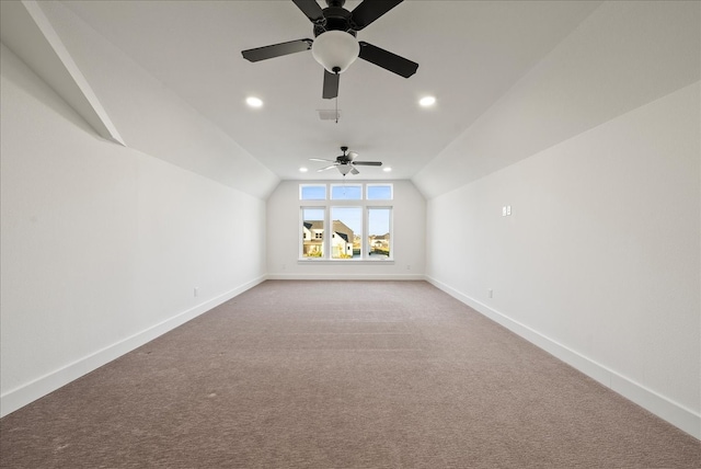 bonus room featuring ceiling fan, carpet, and vaulted ceiling