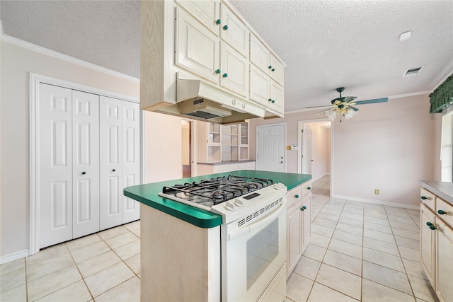 kitchen with a textured ceiling, white range with gas cooktop, crown molding, ceiling fan, and light tile patterned floors