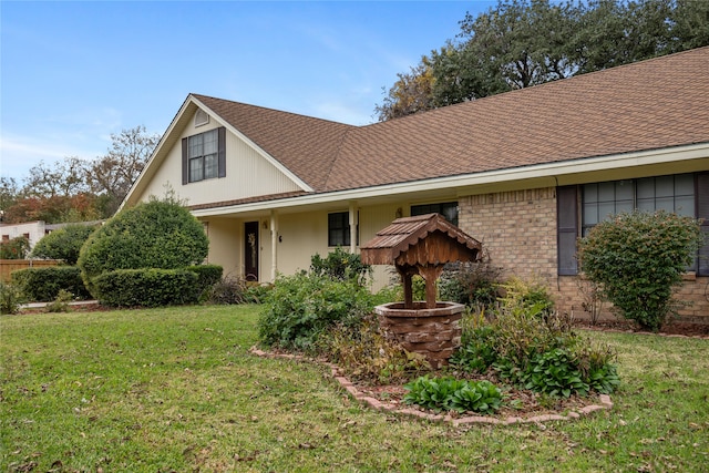 view of front of property with a front lawn