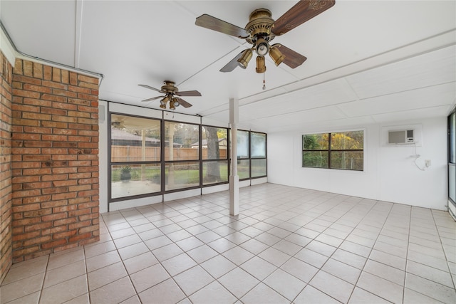 unfurnished sunroom featuring a wall mounted AC and ceiling fan