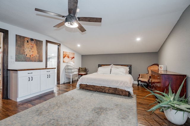 bedroom with ceiling fan, dark hardwood / wood-style flooring, and lofted ceiling