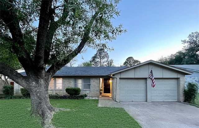 ranch-style house with a front lawn and a garage