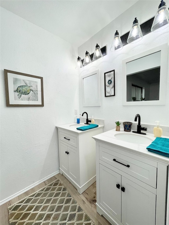 bathroom featuring hardwood / wood-style floors and vanity