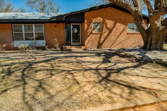 view of front of house featuring brick siding