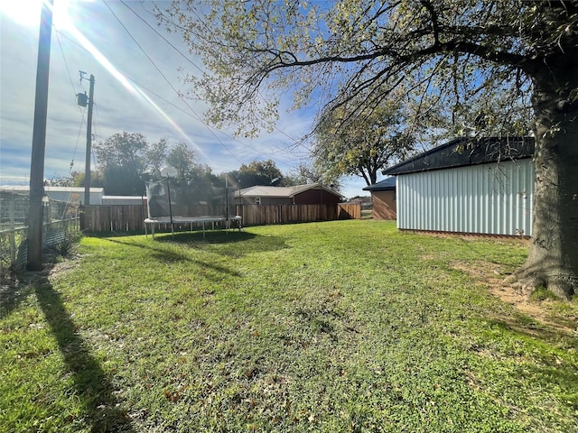 view of yard with a trampoline