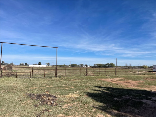 view of yard with a rural view