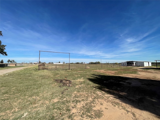 view of yard with a rural view