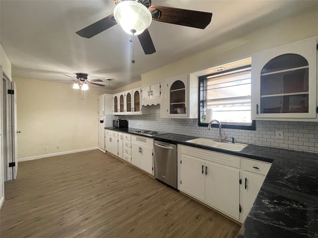 kitchen with sink, stainless steel dishwasher, white cabinets, and dark wood-type flooring