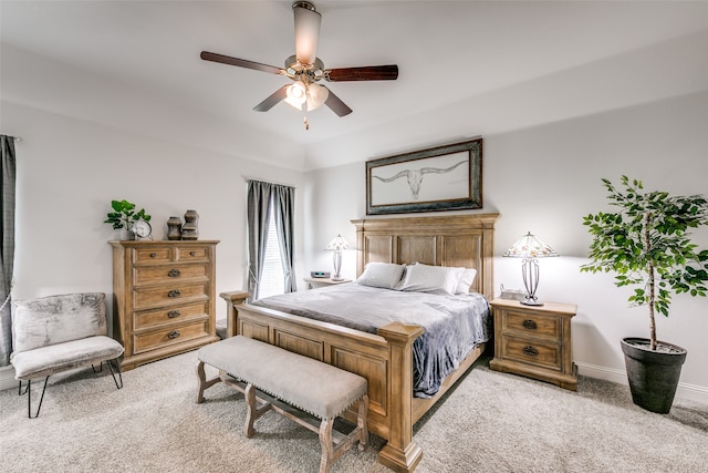 bedroom with ceiling fan and light colored carpet