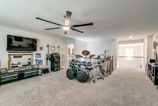 interior space with ceiling fan and carpet