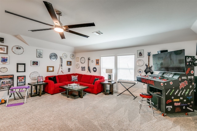 living room featuring carpet flooring, vaulted ceiling, and ceiling fan