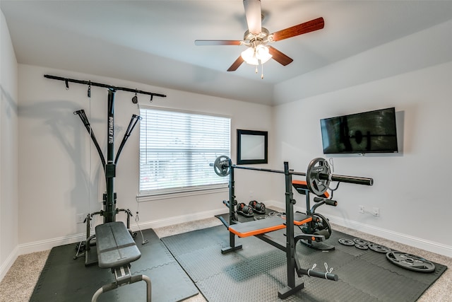 exercise area featuring carpet floors and ceiling fan