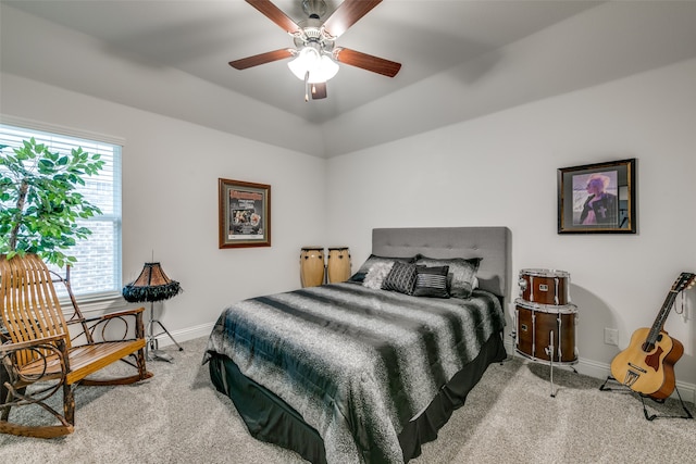 bedroom with ceiling fan and light colored carpet