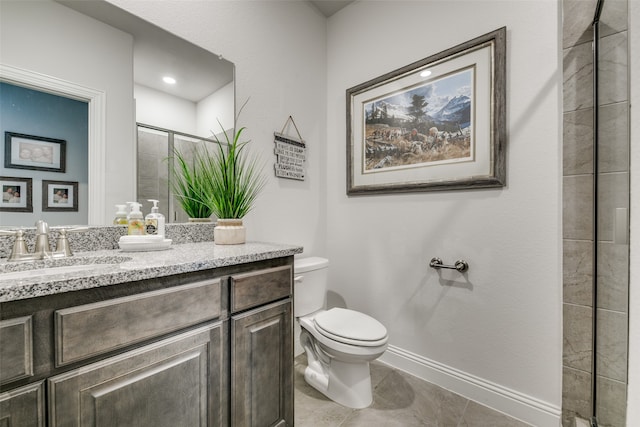 bathroom featuring tile patterned floors, vanity, toilet, and walk in shower