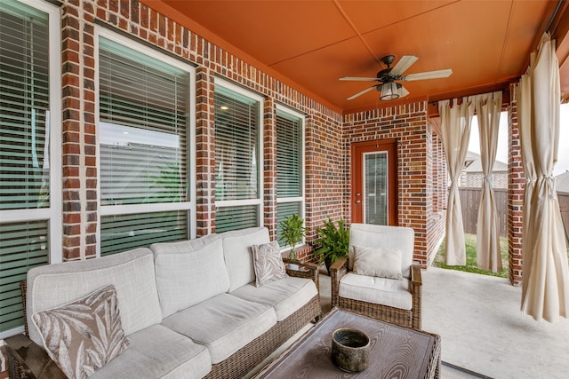 exterior space with ceiling fan and an outdoor living space