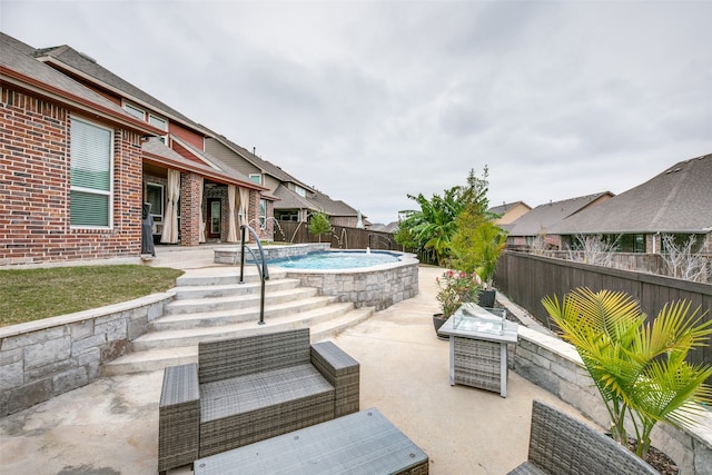 view of patio featuring pool water feature and a fenced in pool