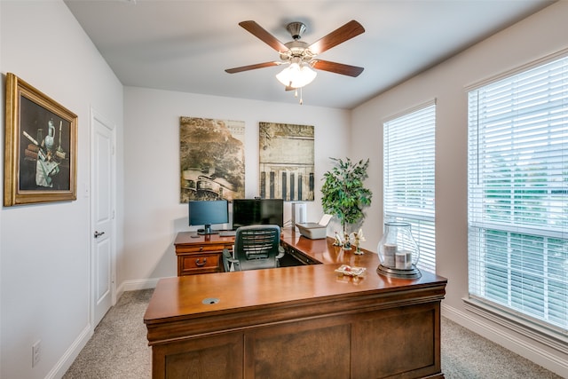 carpeted office with ceiling fan