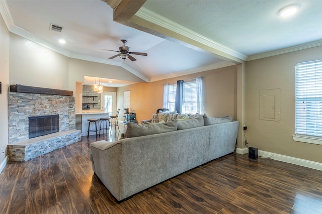 living room featuring dark hardwood / wood-style flooring, crown molding, and plenty of natural light