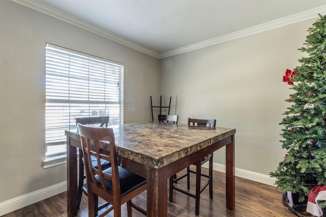 dining room with dark wood-type flooring and ornamental molding