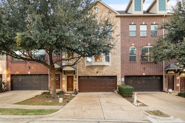 multi unit property featuring a garage