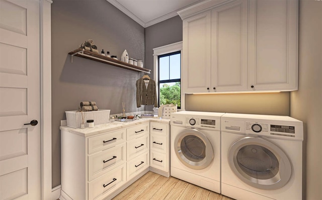 laundry room with crown molding, washer and clothes dryer, cabinets, and light hardwood / wood-style floors