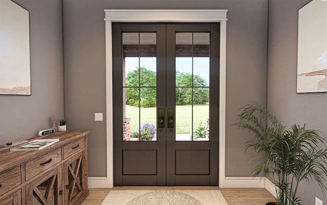 entryway with french doors and light wood-type flooring