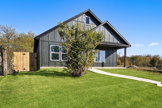 rear view of property with a yard