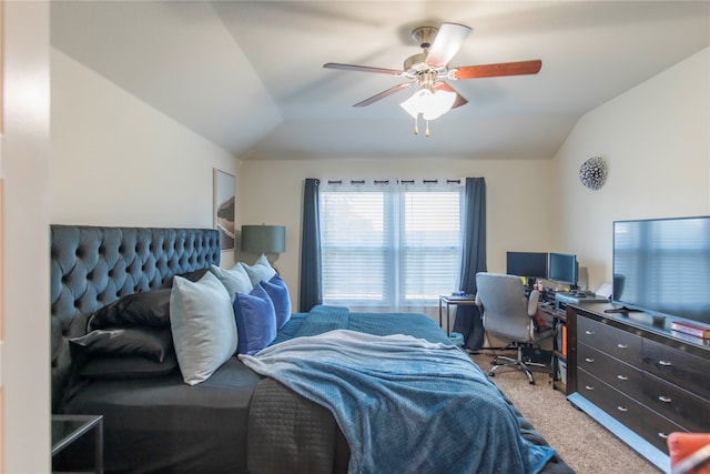 carpeted bedroom featuring ceiling fan and vaulted ceiling