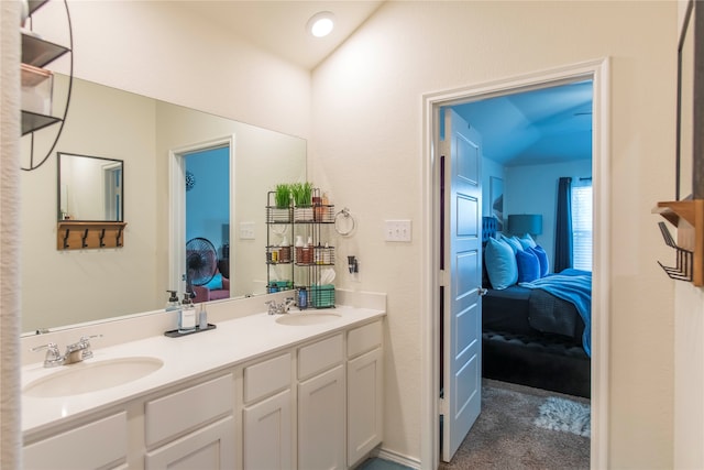 bathroom featuring vanity and vaulted ceiling