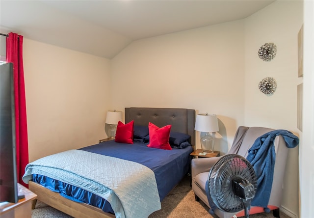 carpeted bedroom featuring lofted ceiling