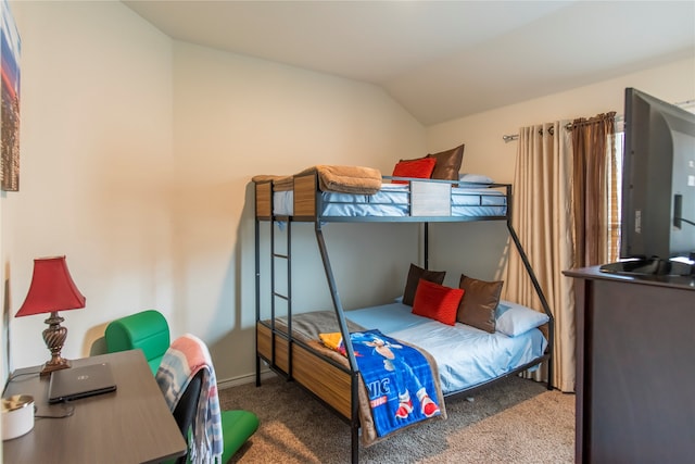 bedroom with carpet and lofted ceiling