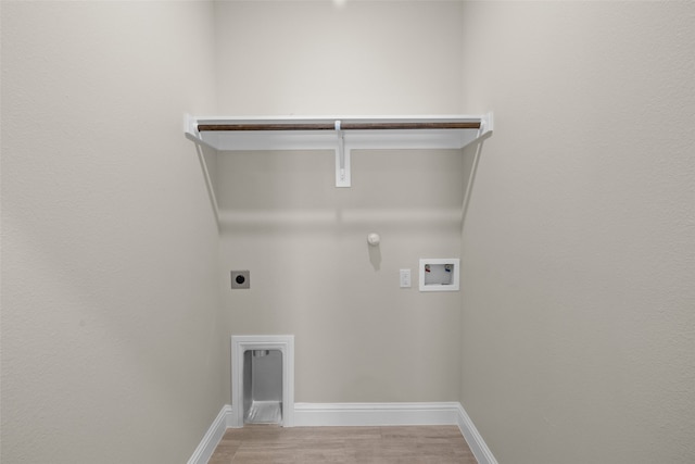 clothes washing area with hookup for an electric dryer, gas dryer hookup, light wood-type flooring, and hookup for a washing machine